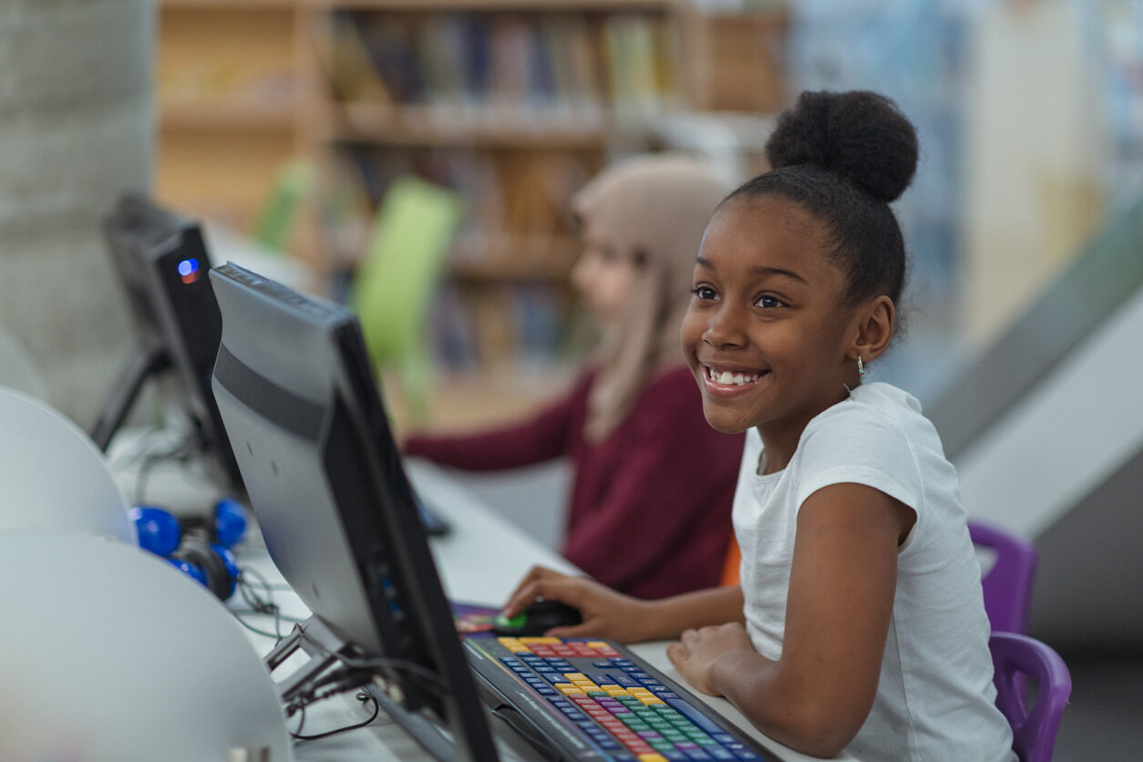 Girl learning how to use JavaScript with Berlitz Digital School