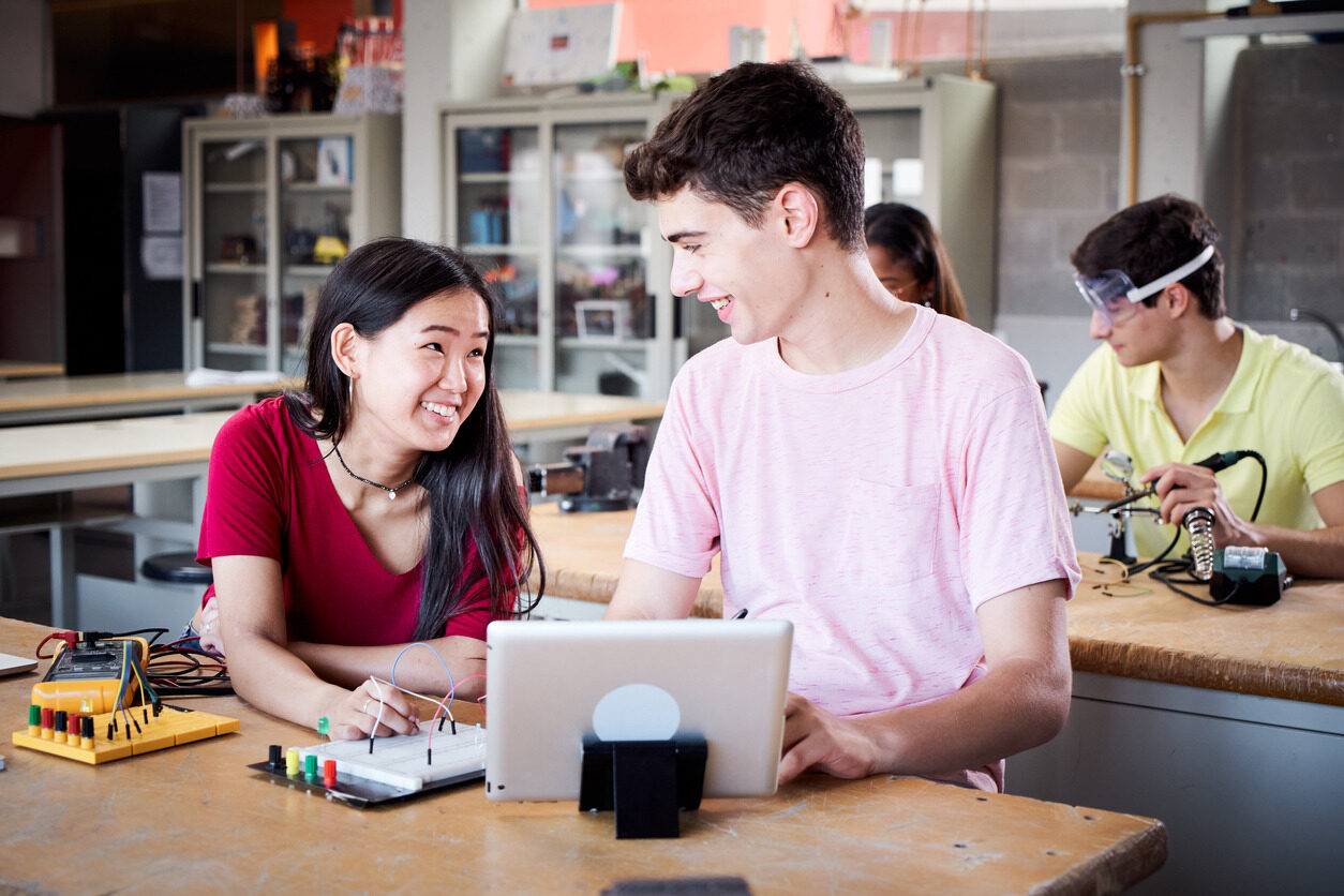 Students in a beginner coding class for children learning about algorithms.